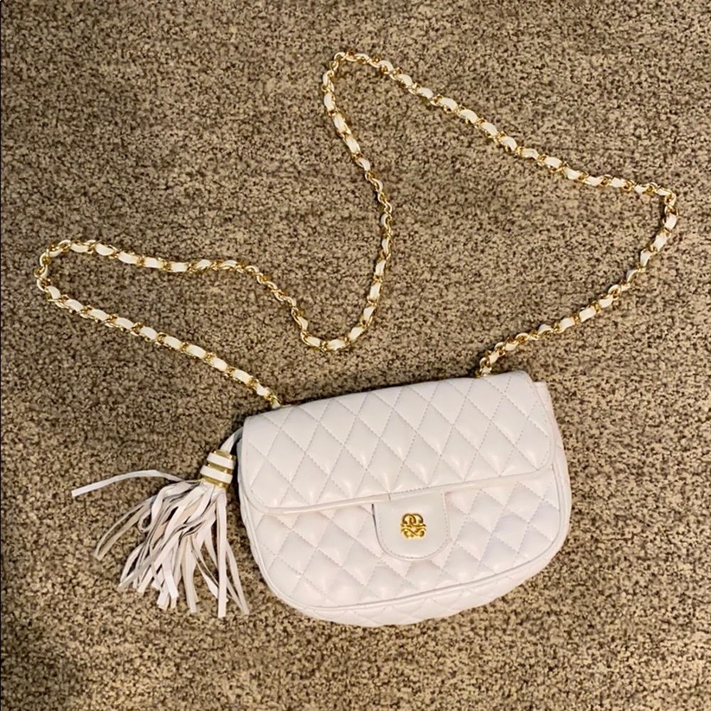 White and gold cross body purse.